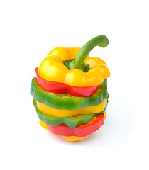red, green and yellow sliced pepper isolated on white background