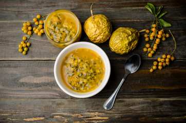 Passion fruits juice on wooden background