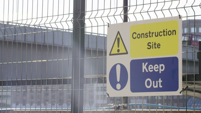4K Construction sign on a site warning passers by to Keep Out
