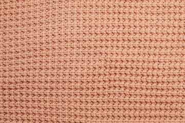 Fototapeta premium Knitted sweater texture background. Stylish vintage cloth. Hipster wardrobe. Fabric textures. Shopping background. 