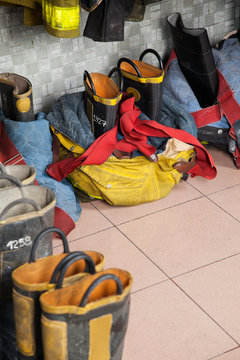 Firefighter's Shoes On Floor At Fire Station