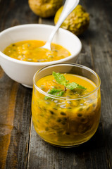 Passion fruits juice on wooden background