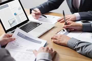 Business professionals analyzing financial data