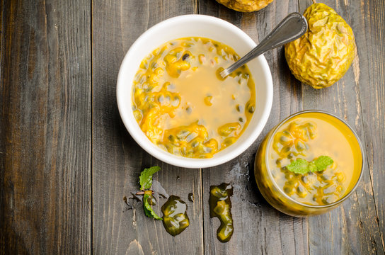 Passion fruits juice on wooden background