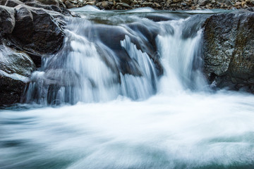 Fototapeta na wymiar Beautiful landscape rapids on a mountains river.