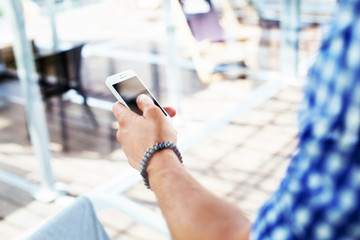 Male hand holding a smartphone