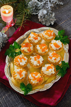 Tartlets with squid and red caviar in the New Year's Eve