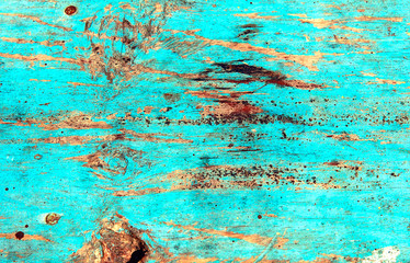The scratched blue wooden background