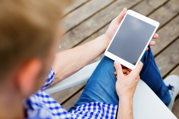 Closeup of man holding digital tablet