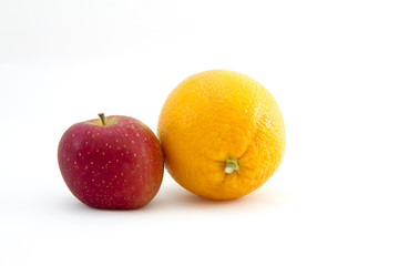 Red apple and an orange on white background