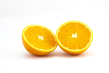 Orange sliced in half on white background