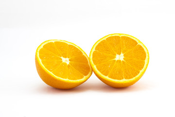 Orange sliced in half on white background