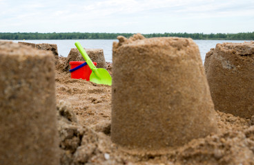 Sand castle / Sand castle with sand toys on water