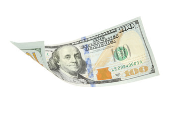 Hundred dollar bill falling on white background
