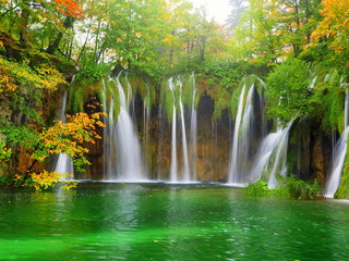waterfalls in a green pond at the plitvice national park