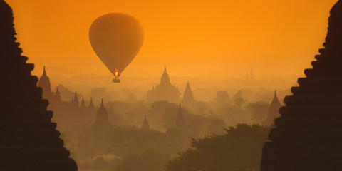 Hot air balloons over the ancient pagodas of the Old Bagan (Myanmar). - 93563865
