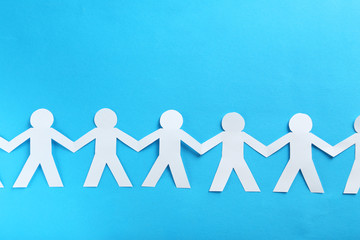 Paper people on the blue paper background