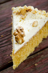 Homemade cake with butter cream and walnuts