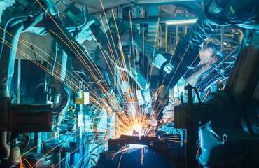 Team welding Robot movement Industrial automotive part in factory