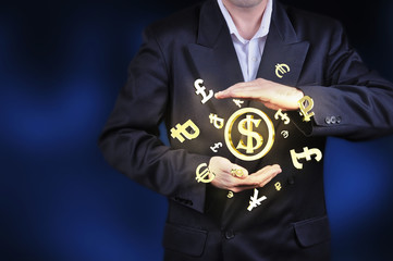 Currency gold symbols in a man hand