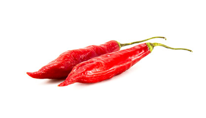 Two red peppers on white background