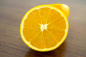 closeup of sliced orange over a wooden table