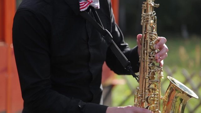 Closeup musician playing the saxophone