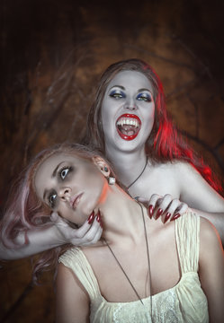 Beautiful vampire woman and her victim