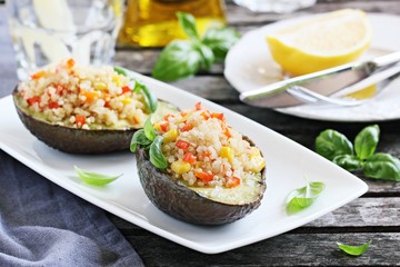 Grilled avocado staffed with quinoa vegetables salad.Selective focus 