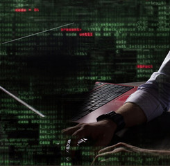 hacker at work with graphic user interface around