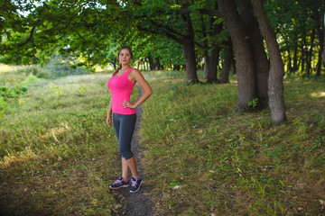 Girl European appearance young brown-haired woman in a pink shir