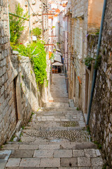 Fototapeta na wymiar Narrow street and stairs in the Old Town in Dubrovnik, Croatia 