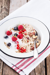  Granola, muesli , honey, yogurt and fresh berries .Healthy breakfast.selective focus