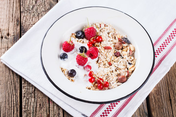 Granola, muesli , honey, yogurt and fresh berries .Healthy breakfast.selective focus
