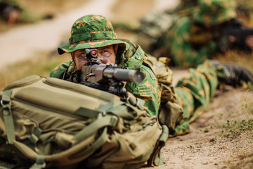 Fototapeta premium russian soldier in the battlefield with a rifle