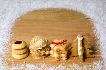 Christmas  cookies  isolated on wood background and snow.