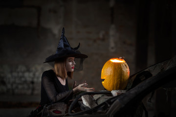 Witch talking to a pumpkin