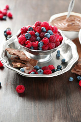 Beautiful composition with chocolate cream and ripe berries