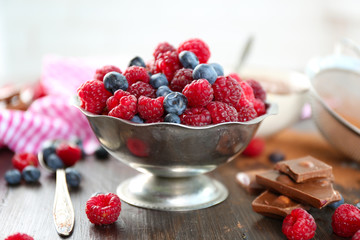Beautiful composition with chocolate cream and ripe berries