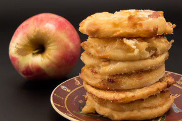 Fried apples with fresh apple.