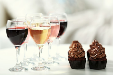 Tasting of wine and chocolate cupcakes, close up
