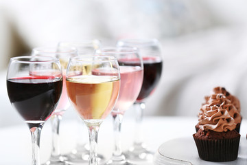Tasting of wine and chocolate cupcakes, close up