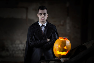 Vampire standing next to Jack O' Lantern, Halloween theme