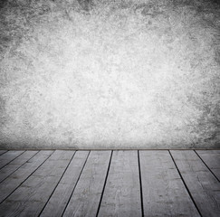 Grunge wall and wood paneled floor, interior of a room.