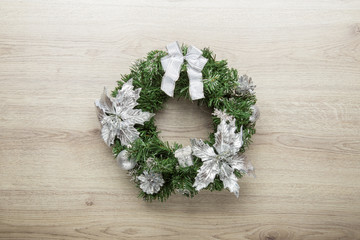 Christmas decorative wreath on wooden background
