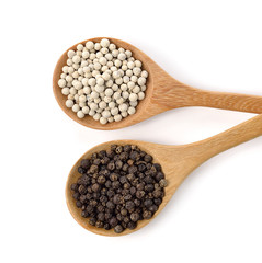 Wooden spoon and peppercorn on white background