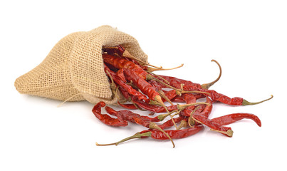 dried hot red chillies in a sack on white backgroud