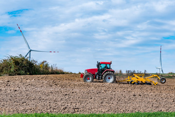 Autumn field works close to the windmills