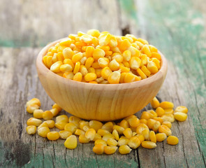 corn in the wood bowl on wooden