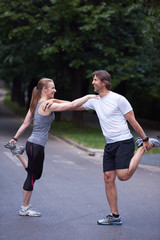 jogging couple stretching